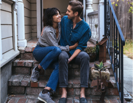 Couple Sitting on Steps of House