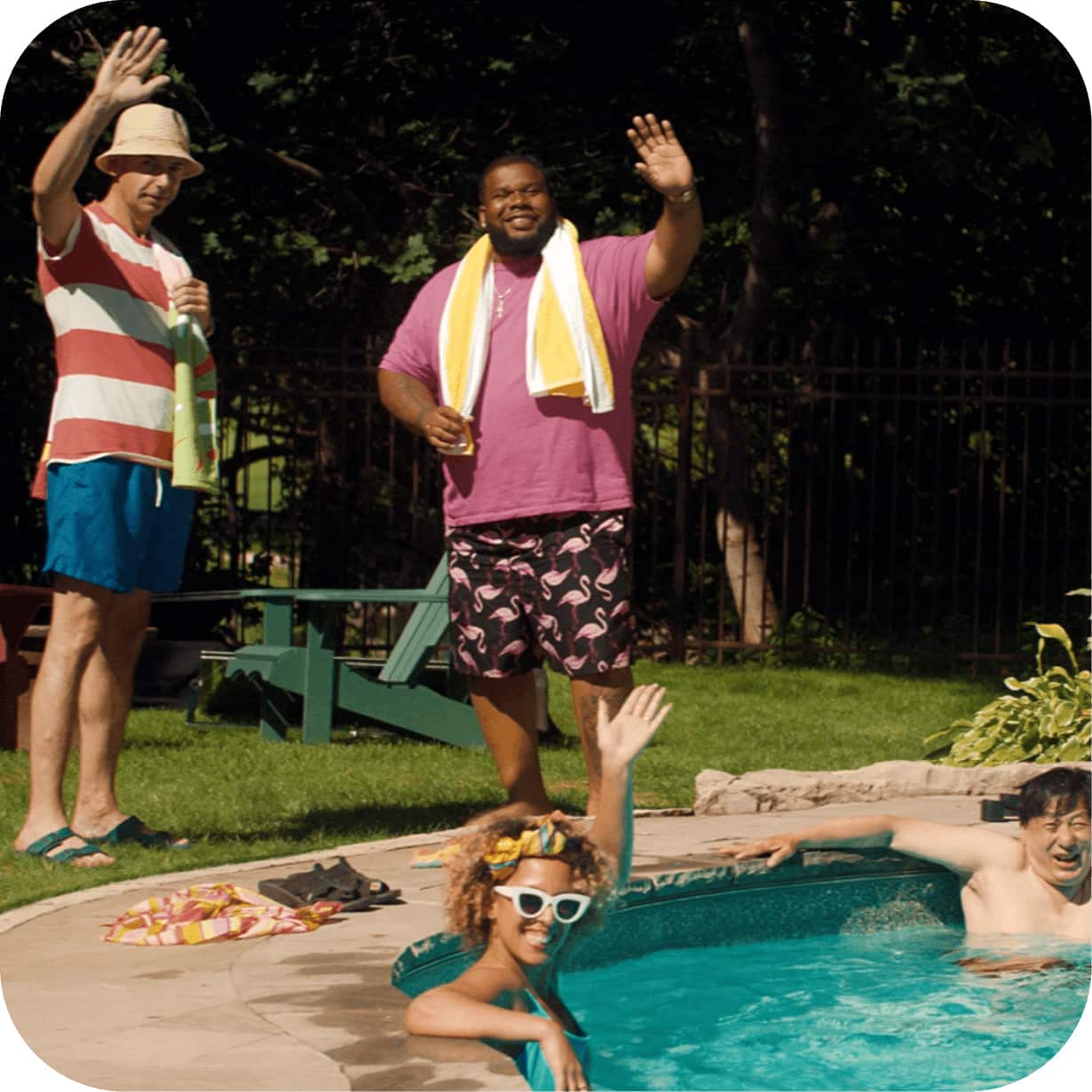 People in a backyard swimming pool