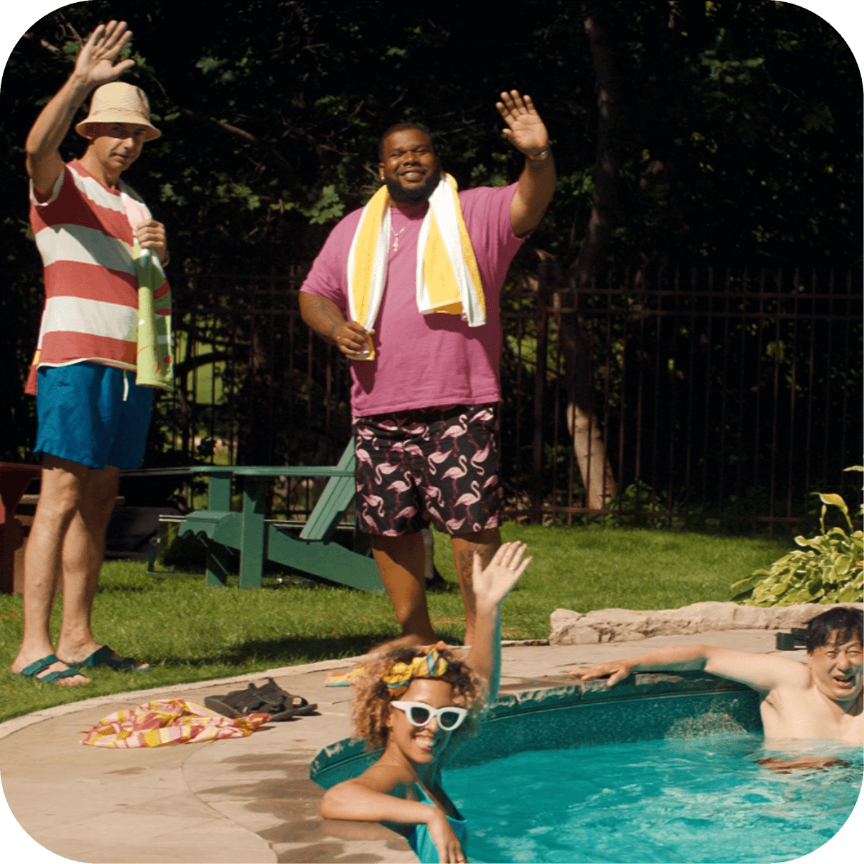People in a backyard swimming pool