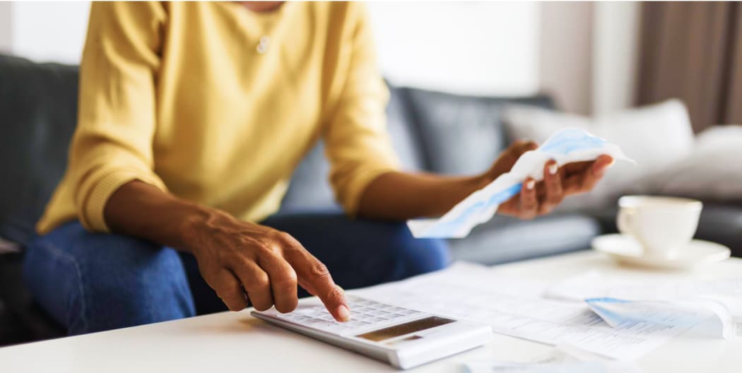 woman calculating loan offers