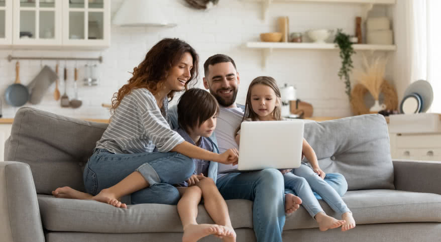 family looking at homes on computer
