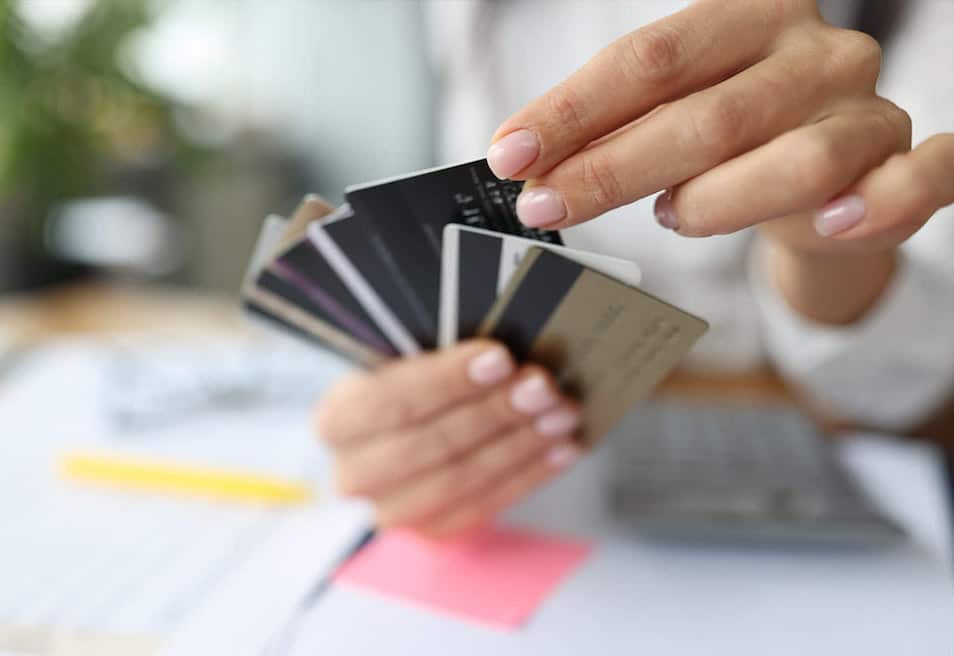 hand holding credit cards