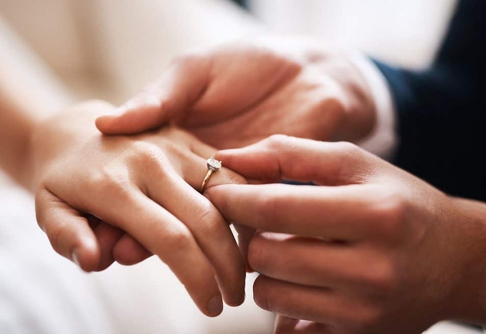 A wedding ring on a finger