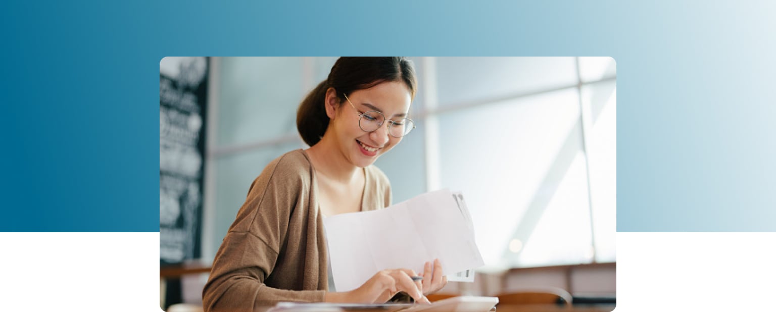 woman receiving personal loan documents