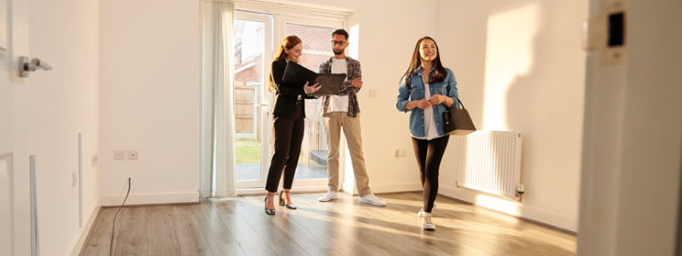 Homebuyers and realtor finding a starter home