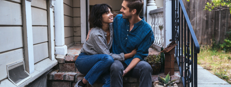 Couple reviewing pre-approval documents for home purchase