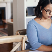 woman researching mortgage refinance options on computer