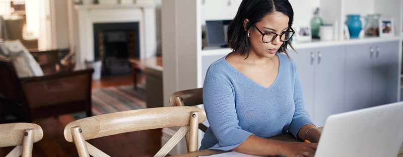 woman researching mortgage refinance options on computer