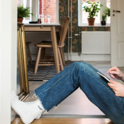 man researching home buying options on tablet