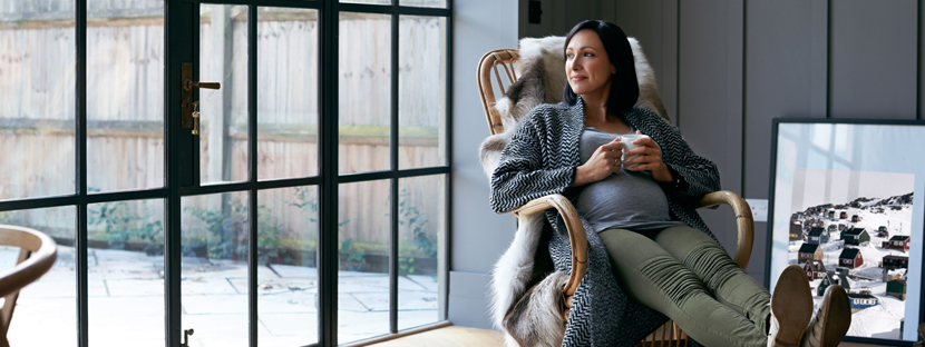 woman thinking about mortgage refinance options