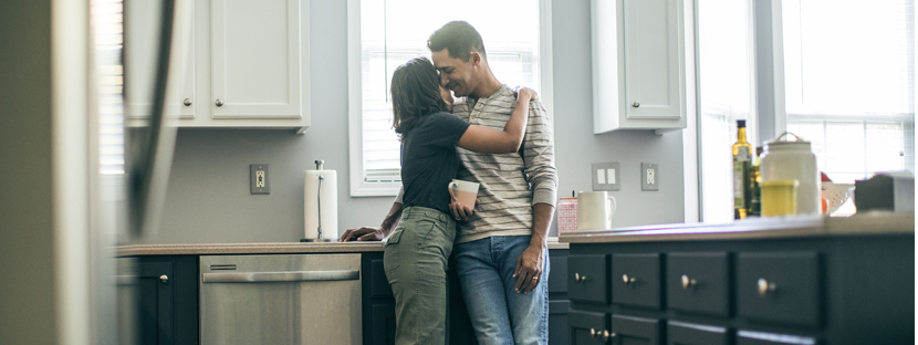 couple discussing home appraisal in kitchen