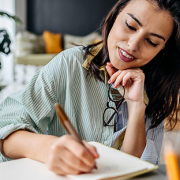 woman signing final documents to close on new house