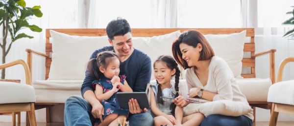 Family celebrating moving into their new home.