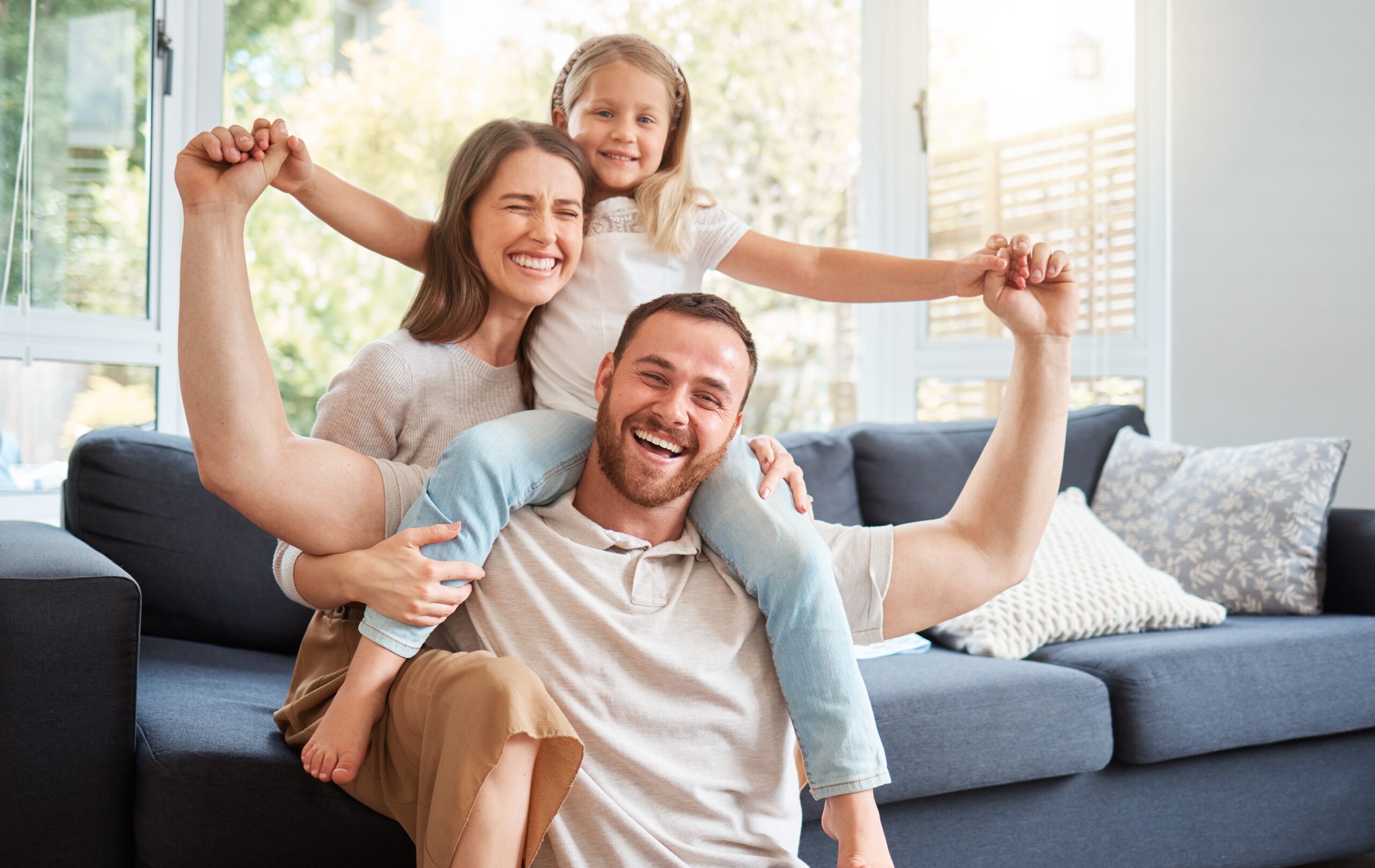 happy smiling family content in their living room at home