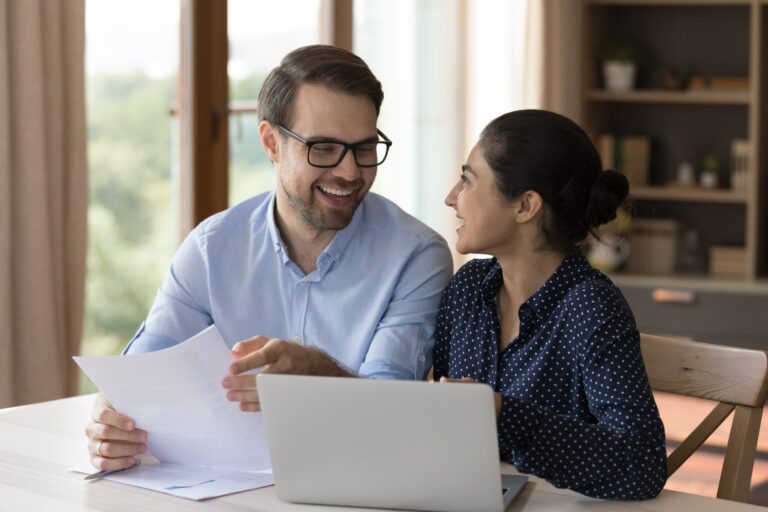 couple researching home equity loan vs. personal loan options online