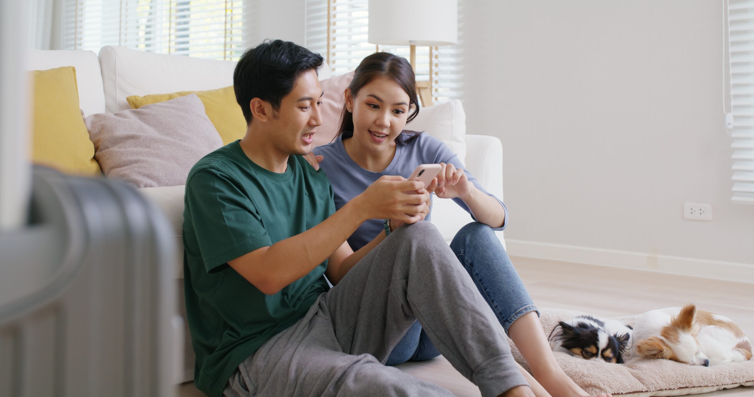young couple at home calculating home buying vs renting